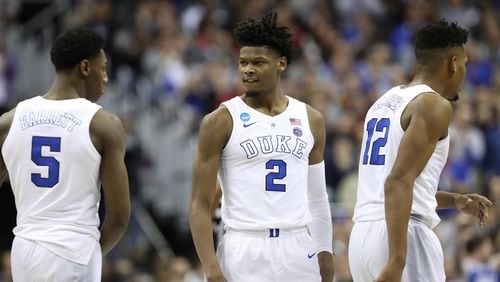 RJ Barrett (5), Cam Reddish (2) and Javin DeLaurier (12) of the Duke Blue Devils celebrate a basket against the Michigan State Spartans during the second half in the East Regional game of the 2019 NCAA Men's Basketball Tournament at Capital One Arena on March 31, 2019 in Washington, DC. (Photo by Rob Carr/Getty Images)