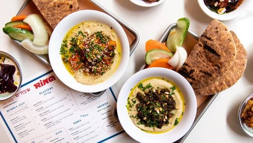 Rina Hummus No. 3 with roasted spiced butternut, dukkah, and harissa, and Hummus No. 2 with Baharat ground beef, pine nuts, and herbs. Photo credit- Mia Yakel.