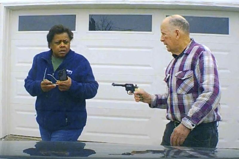 In this image taken from Uber dashcam video released by the Clark County, Ohio, Sheriff's Office, William Brock, right, holds a weapon to Uber driver Loletha Hall outside his home in South Charleston, Ohio, on March 25, 2024. Brock, 81, who authorities say fatally shot Hall who he thought was trying to rob him after scam phone calls deceived them both, was indicted on a murder charge, Monday, April 15, 2024, by a Clark County grand jury. Hall had no knowledge of the calls made to Brock, authorities said. (Clark County Sheriff's Office via AP)