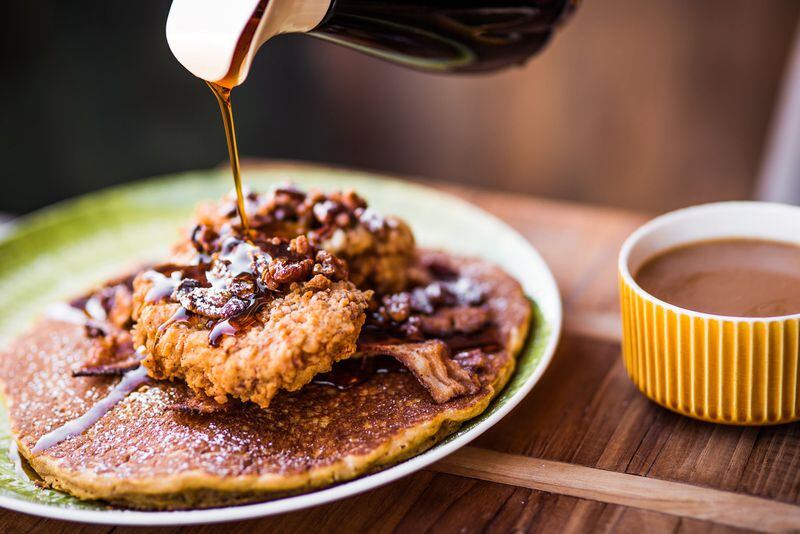 The Shoo Mercy Pancake is Tupelo Honey Cafe’s spin on chicken and waffles, featuring a sweet potato pancake, whipped peach butter, spiced pecans, buttermilk fried chicken, apple cider bacon and maple syrup. Contributed by Tupelo Honey Cafe