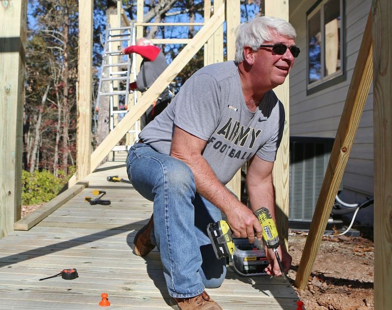 Army veteran Jim Lindenmayer, head of the Cherokee County Homeless Veteran Program, helps build a handicap ramp for a veteran in November in Canton, Georgia. He says the VA system to give public information about the quality of healthcare the VA provides is useless. CHRISTINA MATACOTTA FOR THE ATLANTA JOURNAL-CONSTITUTION