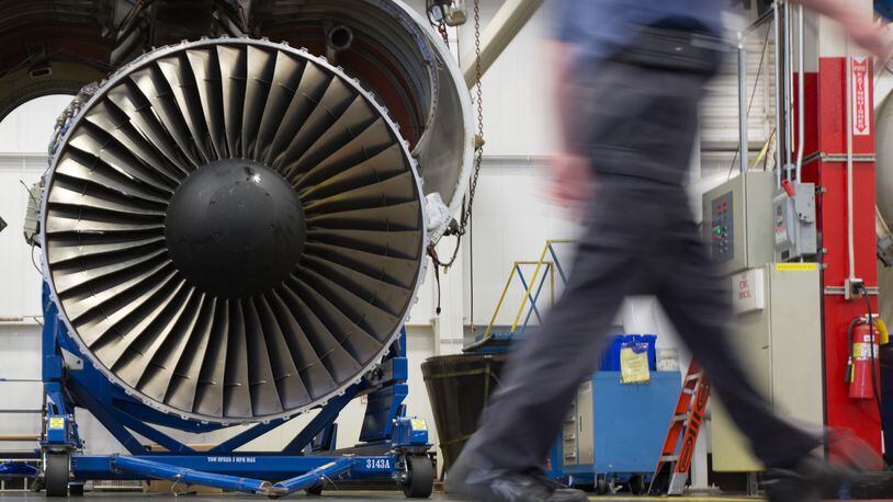 A Delta TechOps employee walks past an airplane engine inside a Delta TechOps building near Hartsfield-Jackson Atlanta International Airport, Monday, Oct. 26, 2015, in Atlanta. Delta announced a new partnership with Rolls Royce as an approved maintenance center. BRANDEN CAMP/SPECIAL