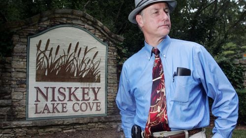 Retired Atlanta homicide detective Danny Agan talks at the entrance to Niskey Lake Cove subdivision off Niskey Lake Road in Southwest Atlanta, near where the first two bodies linked to the Atlanta child murders were found.