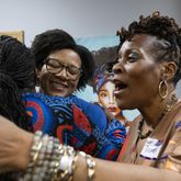 Mayors Sandra Vincent from McDonough, from left, Angelyne Butler from Forest Park, Bianca Motley Broom from College Park and Teresa Thomas Smith from Palmetto greet each other before an event to celebrate Black women mayors in College Park on Wednesday, Feb. 28, 2024. (Ben Gray / Ben@BenGray.com)