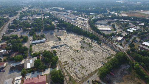 This aerial shows the old Fenner-Dunlop mill district in the center. But to the center-left lies the four acres owned by Avondale Estates, most of which is currently parking. The city’s Downtown Development Authority has created a “process map” for outlining definitive development plans regarding those four acres. Courtesy Avila Real Estate.