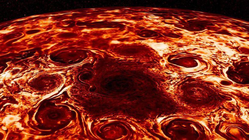 This composite image, derived from data collected by the Jovian Infrared Auroral Mapper instrument aboard NASA’s Juno mission to Jupiter, shows the central cyclone at the planet’s north pole and the eight cyclones that encircle it.