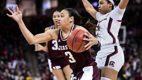 FILE - In this Sunday, March 1, 2020, file photo, Texas A&M guard Chennedy Carter (3) drives against South Carolina guard Zia Cooke (1) during the second half of an NCAA college basketball game in Columbia, S.C. Carter has submitted paperwork to enter the WNBA draft, which is scheduled to be held April 17, 2020. (AP Photo/Sean Rayford, File)