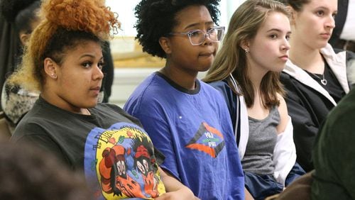 Decatur High School students Lena Clark (from left), Nadia Crawlle, Trevi Carlton, and Olivia Poth-nebel, who all said they would participate in the National Student Walk Out, listen during a meeting while organizers train students on Monday, March 12, 2018, in Atlanta. Curtis Compton/ccompton@ajc.com