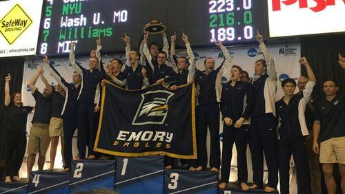 The Emory men’s swim team on the winner’s podium on Saturday night in Shenandoa, Texas. (Photo courtesy of Emory)