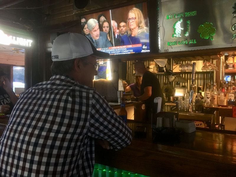 Brad Breitbach watches the Ford-Kavanaugh hearing at Mulligan's Food and Spirits in Marietta, PHOTO: Jennifer Brett/AJC