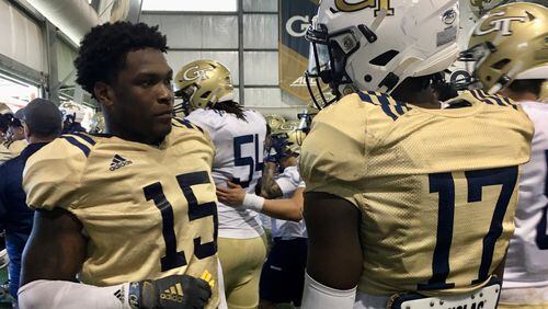 Georgia Tech linebacker Jerry Howard (15) talks with linebacker Demetrius Knight (17) during a break in practice March 7, 2020 at the Brock Football Practice Facility. (AJC photo by Ken Sugiura)