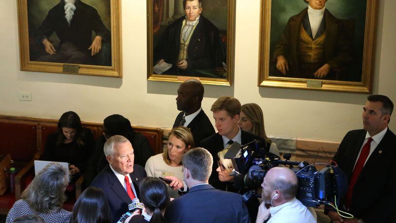 Gov. Nathan Deal in a scrum of reporters after his State of the State address on Wednesday. Bob Andres, bandres@ajc.com