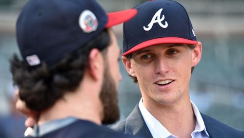 Kyle Wright is pictured talking with Braves shortstop and former Vanderbilt teammate Dansby Swanson after Wright signed with the Braves following the 2017 draft.  HYOSUB SHIN / HSHIN@AJC.COM