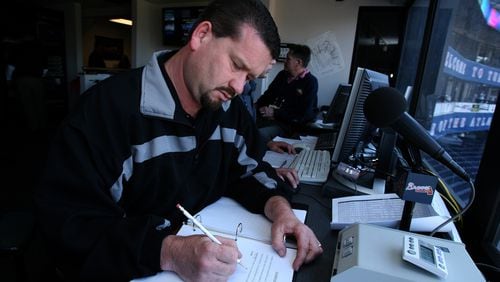Braves public address announcer Casey Motter looks over his notes before the Braves' home opener in April 2007. Motter, whose first season was 2007, died Wednesday, the team announced Thursday. (Johnny Crawford / AJC file)