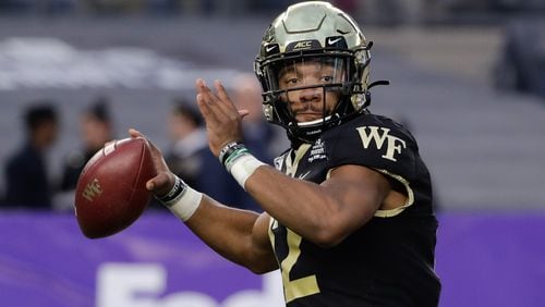 Wake Forest quarterback Jamie Newman (12) throws a pass during the Pinstripe Bowl against Michigan State on Friday, Dec. 27, 2019, in New York. (AP Photo/Frank Franklin II)