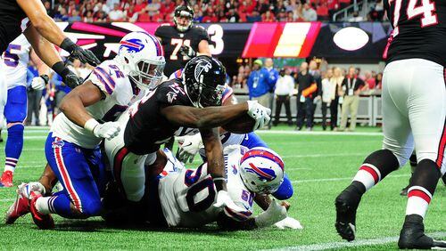 Falcons wide receiver Mohamed Sanu reaches for extra yardage during the first half against the Bills at Mercedes-Benz Stadium on October 1 in Atlanta.