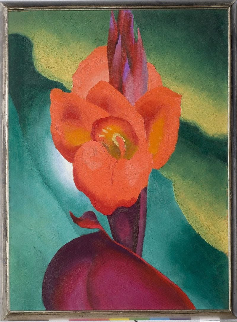 Several works by Georgia O’Keeffe, including this 1919 painting “Red Canna,” distinguish the new show at the High Museum, “Cross Country.” CONTRIBUTED BY HIGH MUSEUM
