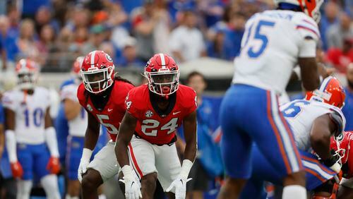 Bulldogs defensive backs Kelee Ringo (5) and Malaki Starks are looking forward to facing Tennessee on Saturday in Athens. (Jason Getz / Jason.Getz@ajc.com)