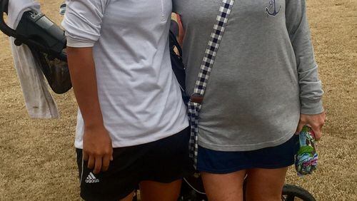 Liza Eubanks (left) with former Georgia star Terry Moody earlier this year. Eubanks leads the Class AAAAA tournament.