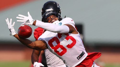 Falcons wide receiver Russell Gage is open on a long route but can't hold on to the pass during team practice Monday, July 29, 2019, in Flowery Branch.