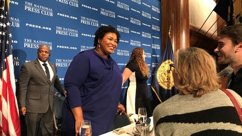 Former Democratic gubernatorial candidate Stacey Abrams speaks to guests after her speech Friday at the National Press Club in Washington. Later, she participated in a “fireside chat” with former President Barack Obama during the Democracy Alliance conference. (TIA MITCHELL/TIA.MITCHELL@AJC.COM)