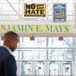 “No place for hate” signs are seen by the lobby of Benjamin E. Mays High School as the school principal, Ramon Garner, waits to be interviewed about the shooting of four students on Wednesday.
(Miguel Martinez /miguel.martinezjimenez@ajc.com)