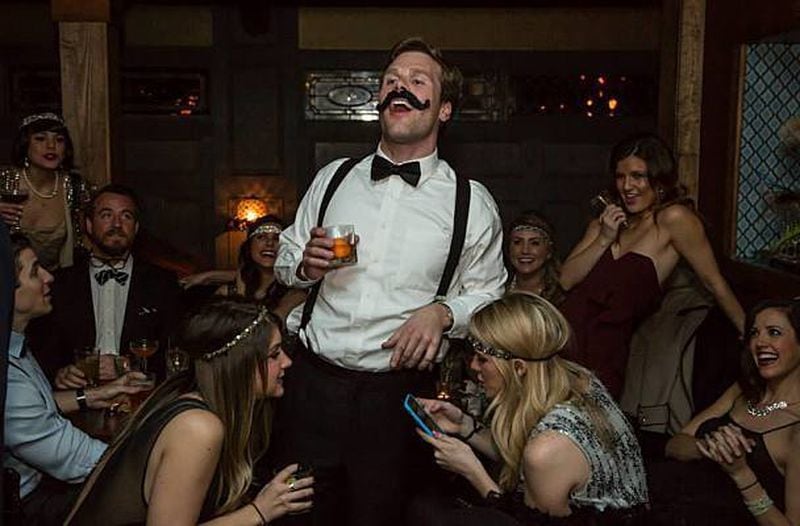 Partygoers enjoy time period fun at The Blind Pig Parlour Bar.