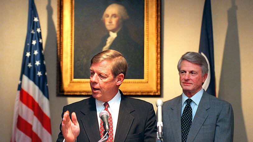 961211. ATLANTA, GA. Johnny Isakson answers questions at the Governor's Mansion Wednesday, 12/11/96, about his appointment to the chair of the State Board of Education. Gov. Zell Miller, in the background, made the announcement of Isakson and other new board members. RICH ADDICKS/STAFF.