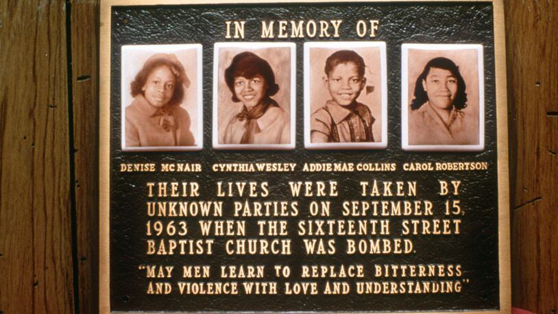 This memorial plaque at  the Sixteenth Street Baptist Church in Birmingham is a tribute to the girls murdered in the 1963 bombing of that church. Shown left to right are Denise McNair, Cynthia Wesley, Addie Mae Collins, and Carol Robertson. (Special to the AJC/David Lee)