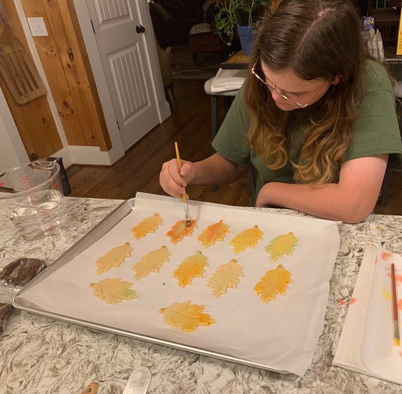 A love of baking and decorating cookies has passed along to the third generation. Gigi Little, Jen Leitheit-Little’s daughter, employs her artistic skills in painting cookies. (Courtesy of Jen Leitheit-Little)