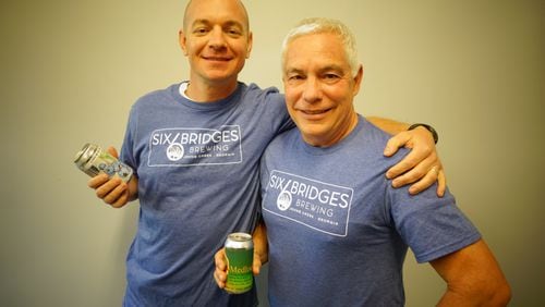 Clay and Charles Gridley opened Six Bridges Brewing in Johns Creek a little more than a year ago. CONTRIBUTED BY SIX BRIDGES BREWING