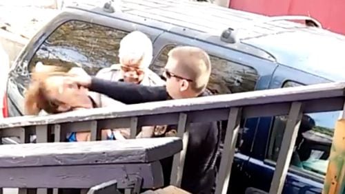 Flagstaff officer captured on video punching woman.