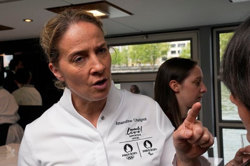 French chef Amandine Chaignot, of the restaurant "Pouliche", who will prepare food for athletes during the Olympic Games, answers questions Tuesday, April 30, 2024 in Paris. Some 40,000 meals will be served each day during the Games to over 15,000 athletes housed at the Olympic village. (AP Photo/Michel Euler)
