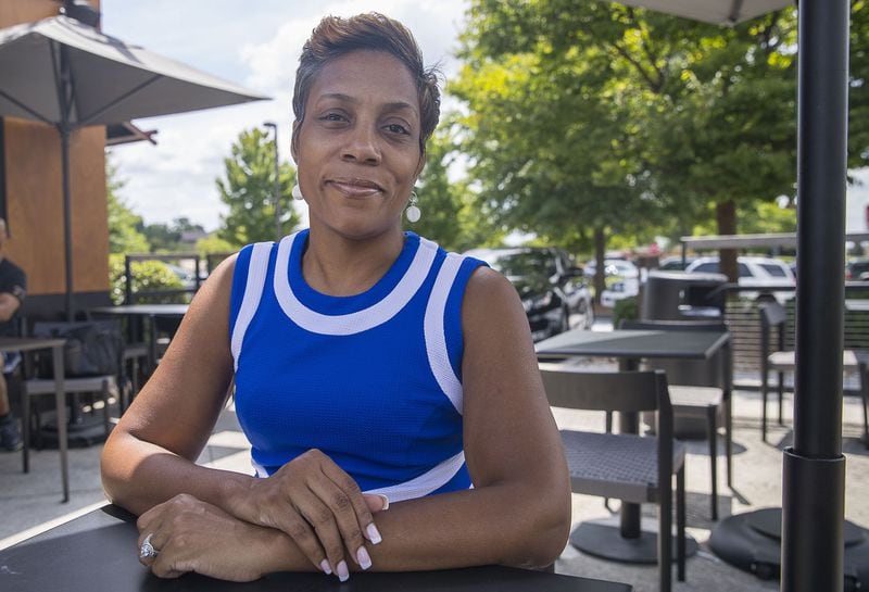 Dionne Hampton sits at a coffee shop in Atlanta on July 18. She has been out of work since April 2019 and is looking for a job in finance. (Alyssa Pointer/alyssa.pointer@ajc.com)