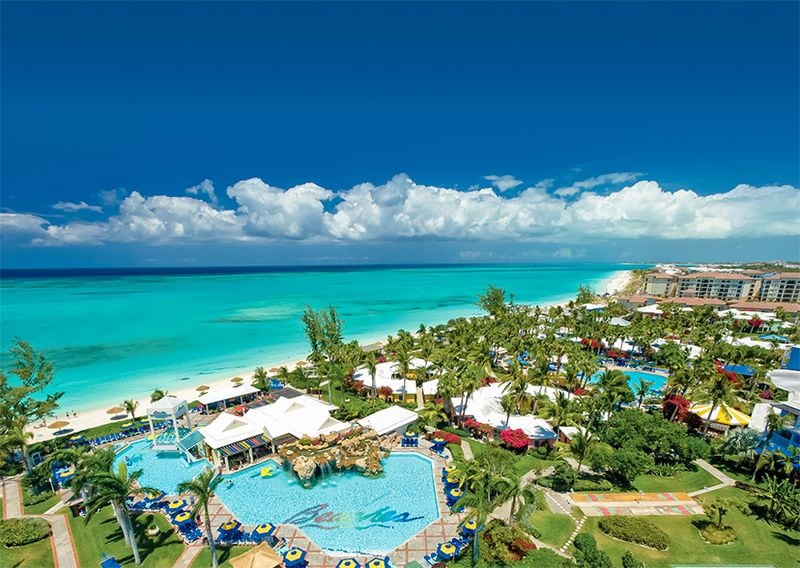 Twelve miles of white-sand beach and 10 swimming pools await visitors to this Caribbean resort.