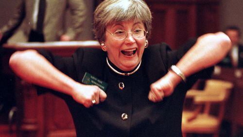 Rep. Kathy Ashe, R-Atlanta, does the 'Dirty Bird' on the floor of the state House in Atlanta on Friday, Jan. 15, 1999. Ashe suggested the legislature do the 'Dirty Bird' to wish the Falcons good luck in their NFC Championship matchup against the Minnesota Vikings. (AP Photo/Alan Mothner)