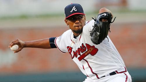 Braves starting pitcher Julio Teheran (49) works in the first inning of a baseball game against the Pittsburgh Pirates Wednesday, May 24, 2017, in Atlanta. (AP Photo/John Bazemore)