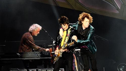 Chuck Leavell (from left) performs keyboards onstage with Ron Wood and Mick Jagger of the Rolling Stones. (Rick Diamond / Getty Images)