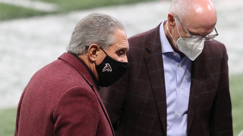 Atlanta Falcons owner Arthur Blank confers with President and CEO Rich McKay on the sidelines Sunday prior to losing to the Tampa Bay Bucs. (Curtis Compton/Atlanta Journal-Constitution/TNS)