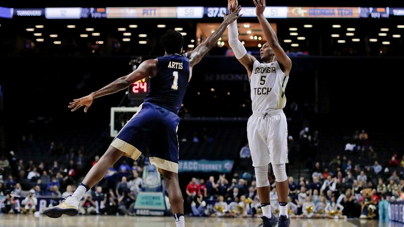 Georgia Tech guard Josh Okogie (5) puts up a shot against Pittsburgh forward Jamel Artis (1) during the second half of an NCAA college basketball game in the first round of the ACC tournament, Tuesday, March 7, 2017, in New York. Pittsburgh won 61-59. (AP Photo/Julie Jacobson)