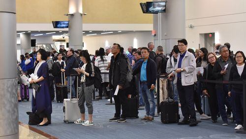 April 12, 2019 Atlanta - International travelers wait in line for processing and interview at customs process area of Hartsfield-Jackson Atlanta International Airport on Friday, April 12, 2019. HYOSUB SHIN / HSHIN@AJC.COM