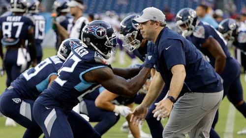 New Falcons head coach Arthur Smith gets down in the trenches with his old team, the Tennessee Titans, back in 2018. (James Kenney/AP)