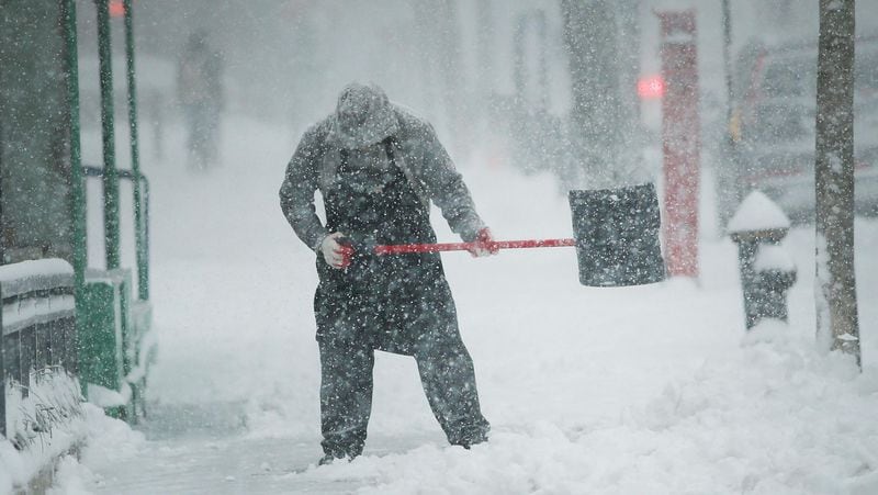 FILE PHOTO: A man shovels snow in the Brooklyn borough of New York City.  (Photo by Spencer Platt/Getty Images)