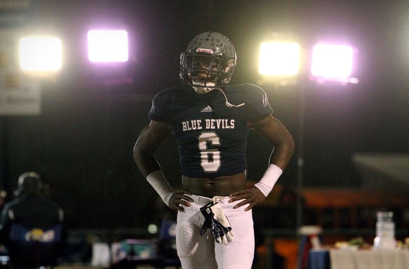 Norcross RB Alvin Kamara waits for the opening kickoff from Colquitt - with TV lights shining bright behind him.