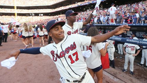 Braves outfielder Mallex Smith tosses a T-shirt to fans after the final game of the season and last game played at Turner Field. (Curtis Compton /ccompton@ajc.com)