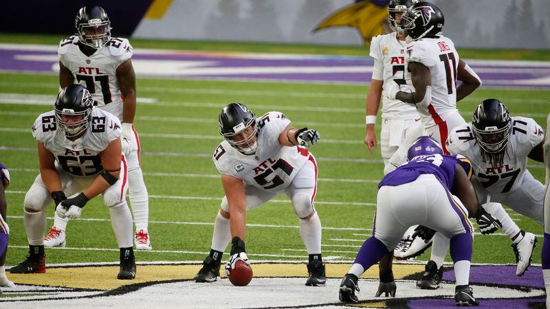 Atlanta Falcons center Alex Mack (51) signals protections from the line of scrimmage against the Minnesota Vikings during the second half Sunday, Oct. 18, 2020, in Minneapolis. (Bruce Kluckhohn/AP)