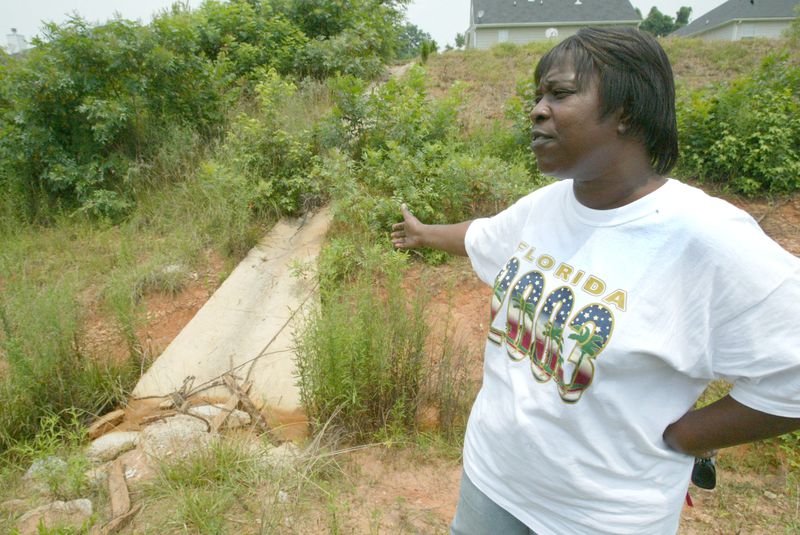 Pauline Holder, seen here in 2003, says Vernon Jones confronted her at her home after she had publicly complained about DeKalb County's handling of flooding issues in her subdivision. She felt threatened, she said, and repeatedly asked him to back away. She later filed a lawsuit against Jones, charging him with tresspass and assault. The suit was settled out of court. (Keith Hadley / AJC file)