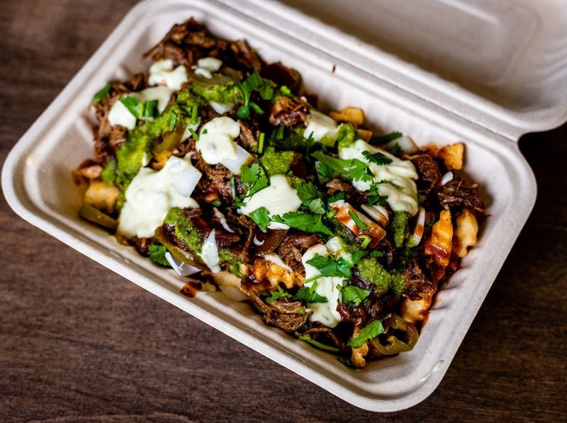 Farmo Fries are shown here with Nihari topping — one of the options — at Atlanta Halal Meat & Food. CONTRIBUTED BY HENRI HOLLIS