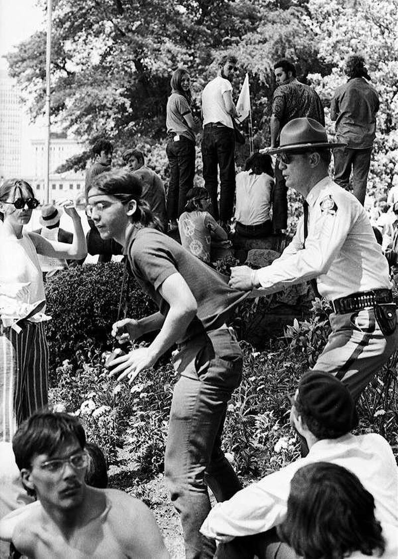 An antiwar protestor at the Georgia State Capitol is nabbed in this 1971 photograph. Working for the alternative press, photographer and reporter Boyd Lewis caught the growing tension between the counter-culture and the mainstream. Photo: Boyd Lewis