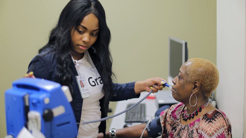 7/28/17 - Atlanta, GA - Lynette McClain, from Atlanta, has her vital signs checked by Marie Carter at a Grady Primary Care Clinic. She opposes repealing or replacing Obamacare. The signature election issue of Republicans for the last seven years, repealing Obamacare, has thus far failed. BOB ANDRES /BANDRES@AJC.COM